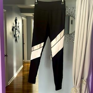 Ladies black Bebe leggings size small.